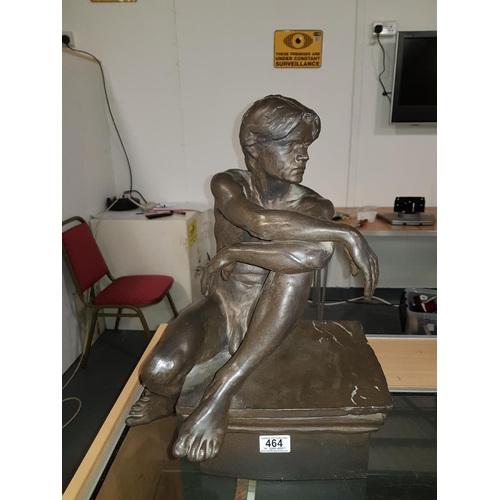 464 - A large 20th Century matte bronze glazed and slip cast ceramic sculpture of a seated nude male