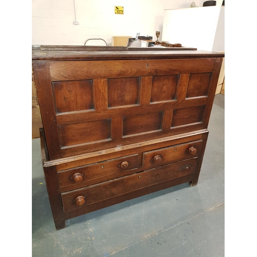 231 - An antique oak chest with 7 panel front on associated base with 3 drawers