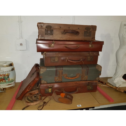 438 - Quantity of vintage leather suitcases, leather briefcase etc.