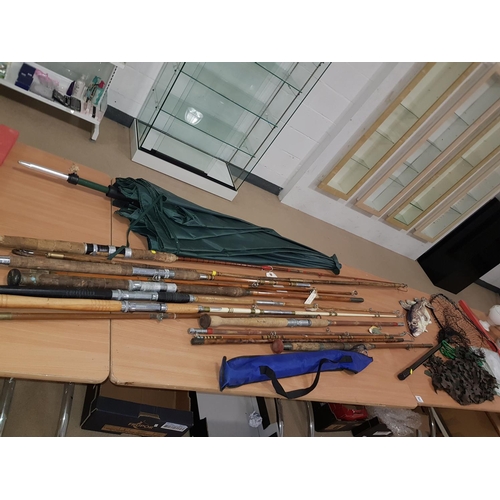 55 - Quantity of fishing rods , fishing umbrella, nets etc.