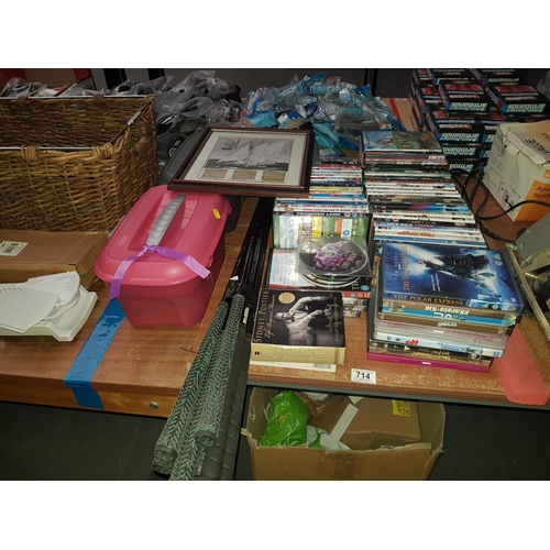 714 - Quantity of DVD's, golf clubs, storage boxes