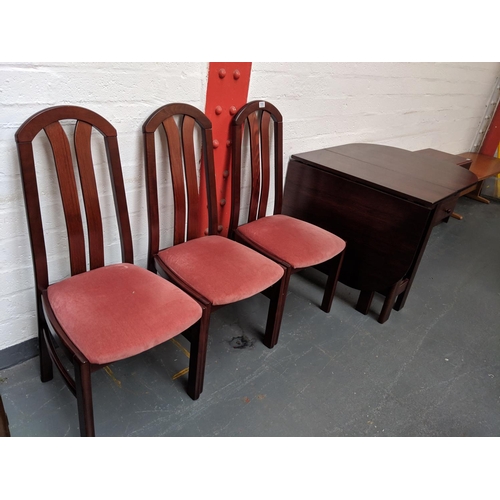 510 - Wooden gateleg dining table and three chairs