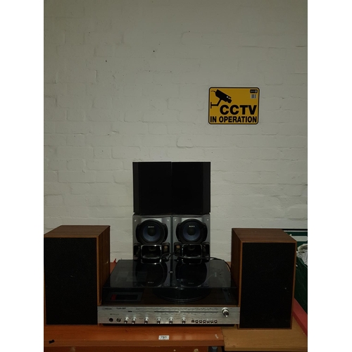 765 - A record player and speakers and two sets of speakers