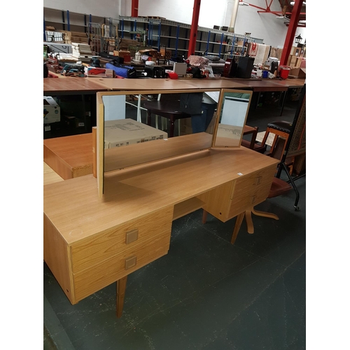 773 - A four drawer dressing table with triple mirror and stool