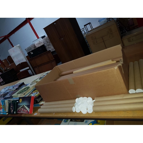 814 - Quantity of jigsaw puzzles and poster storage tubes