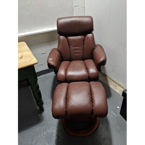 272 - Brown leather swivel and tilt easy chair and footstool