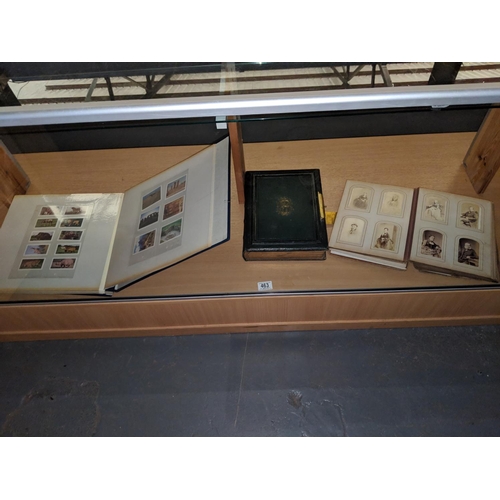 463 - Two photograph albums and an album of cigarette cards