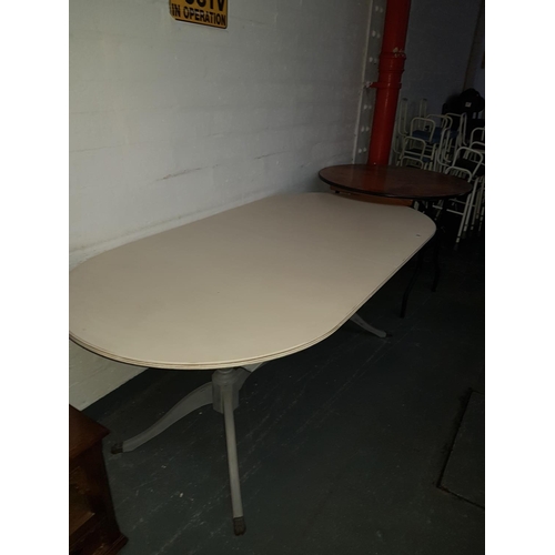 836 - A dining table and a circular fold up table