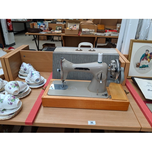 36 - A Concord sewing machine in case