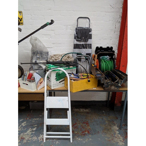 731 - Quantity of tools to include hose reels, step ladders, paint rollers etc.