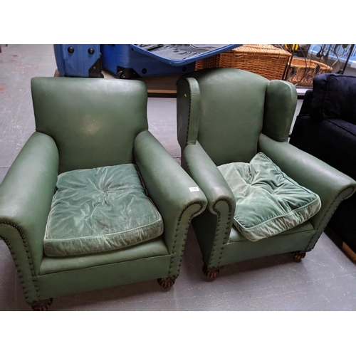 733 - A pair of leather effect armchairs