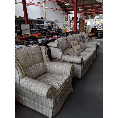 737 - A 3 seater settee and two matching armchairs