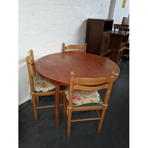 820 - Teak dining table and  three chairs
