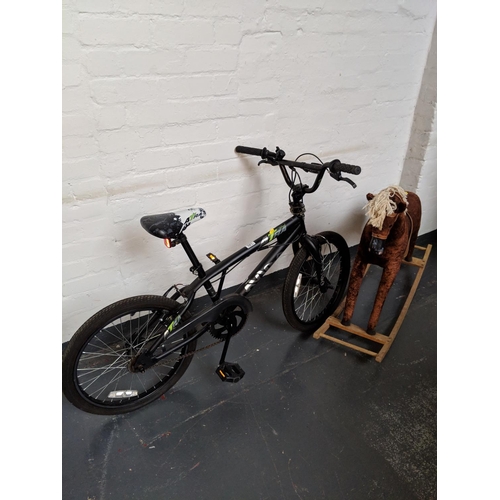 521 - An Astra bicycle and a rocking horse