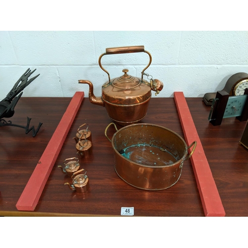 48 - A large copper kettle, smaller kettles etc.