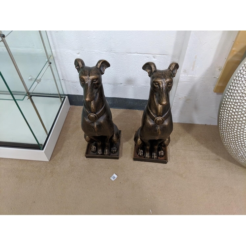 69 - A pair of cast iron large dog figures