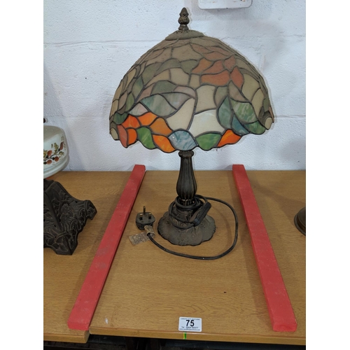 75 - A Tiffany style lamp with brass base