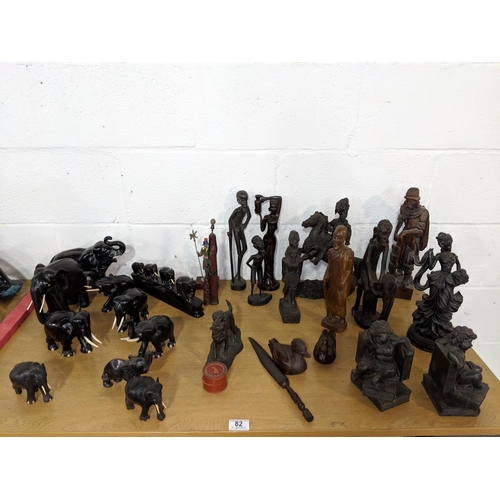 82 - Wooden figurines, elephants etc.