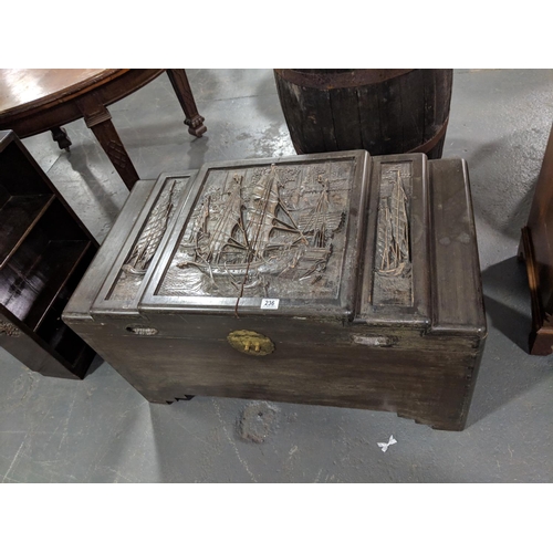 236 - An oriental, carved,camphor chest