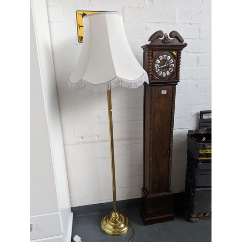 510 - A wooden grandmother clock and a brass standard lamp