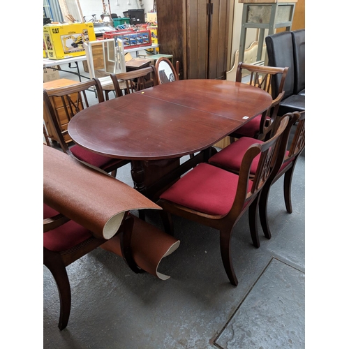 542 - A dining table and six chairs