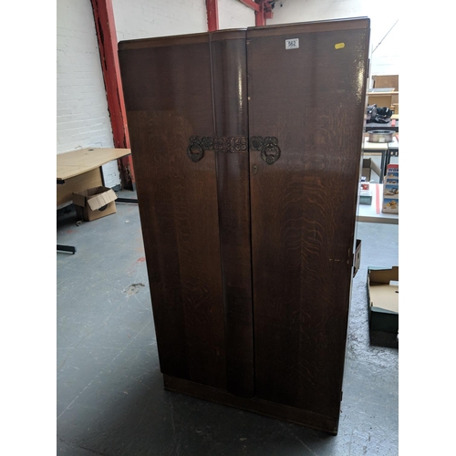 562 - A small double door wardrobe