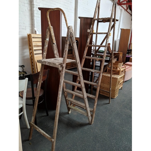 548 - Two sets of wooden step ladders