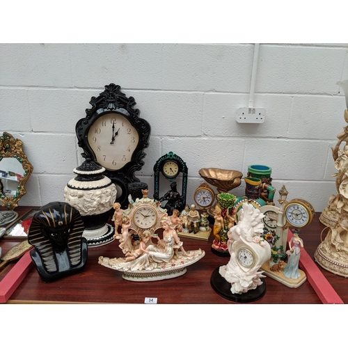 34 - Figural clocks, vases etc.