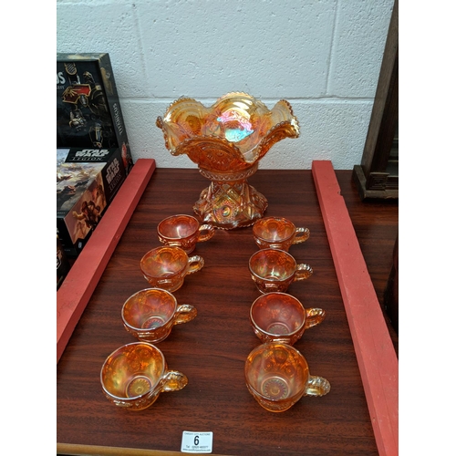6 - Carnival glass, marigold punch bowl on stand with 8 cups