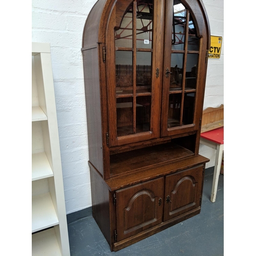663 - A dome topped cabinet