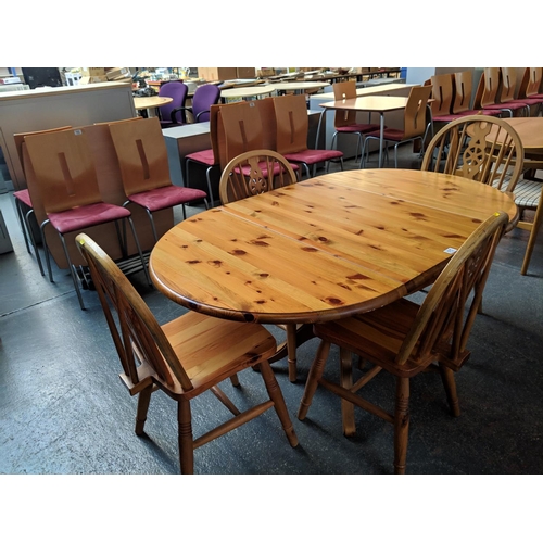 675 - A pine dining table and four dining chairs
