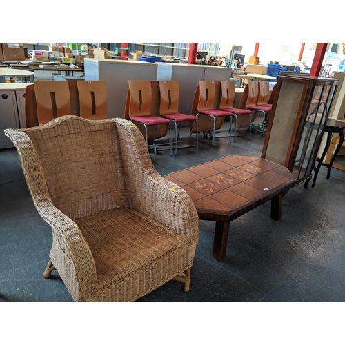 677 - A wicker chair, tile topped coffee table, display cabinet etc.