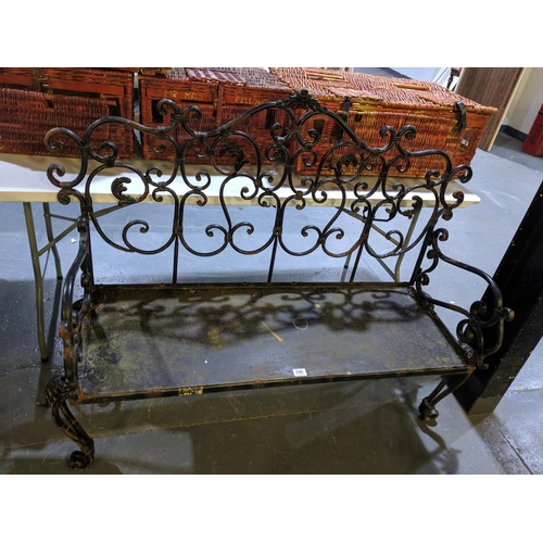 248 - A wrought iron garden bench