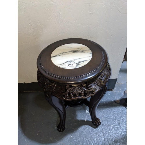 250 - An oriental, Rosewood, marble topped side table