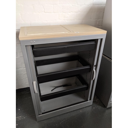 529 - An office filing cabinet with roller doors