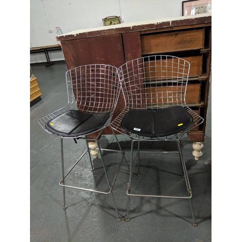 231 - A pair of Bertoia chrome wire work chairs and cushions- 1970's