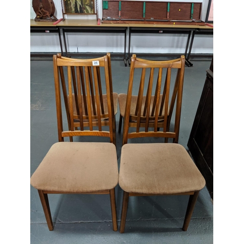 246 - Four teak dining chairs