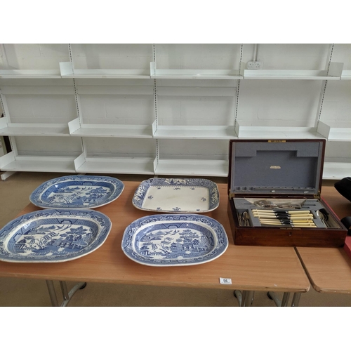 56 - Four large blue and white meat platters and a mahogany cutlery box and contents