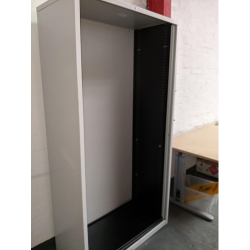 522 - A metal stationary cupboard with roller doors