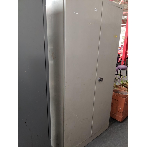 689 - A two door stationary cupboard