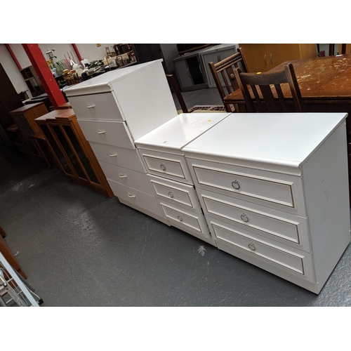 697 - A five drawer chest of drawers and 2 bedside cabinets
