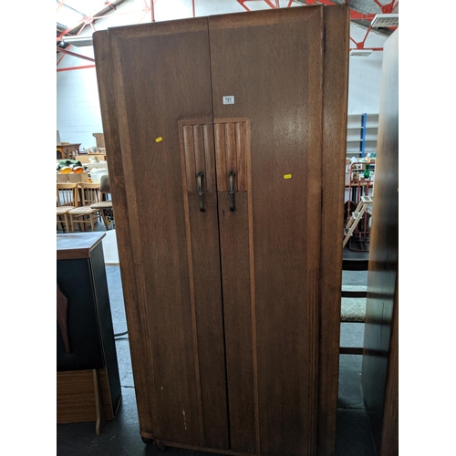 701 - A two door oak wardrobe