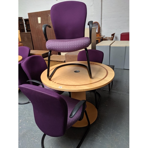 708 - A circular office table and four orangebox chairs