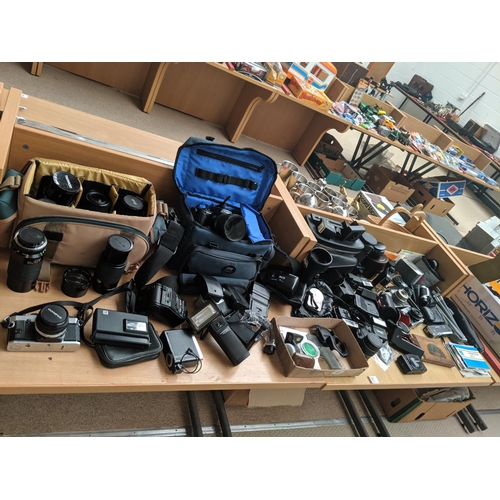 21 - A quantity of cameras, lenses etc including Panasonic DMC-FZ10 etc.