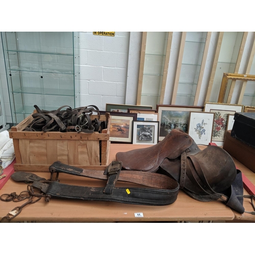 44 - A leather saddle, neck collar and box of horse tack