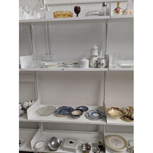 56 - Four shelves of glass and china including decanter, old willow etc.