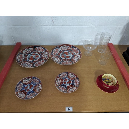 69 - Four Imari plates , three early glasses and an Aynsley cabinet cup and saucer