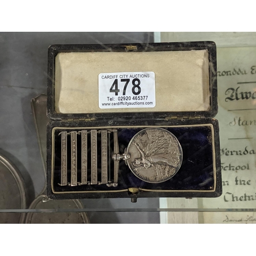 478 - A Queens Coronation medal and an Africa medal with five bars