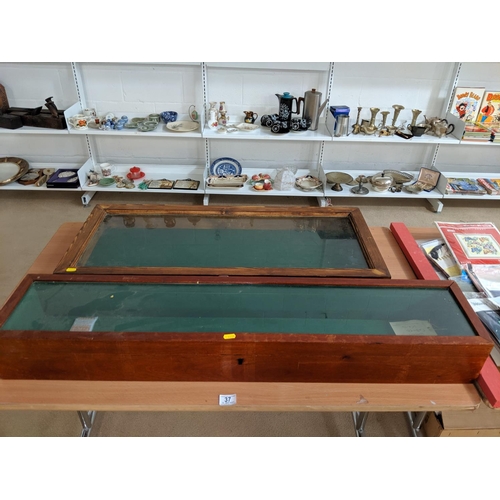 37 - Two wooden display cabinets , key to one inside