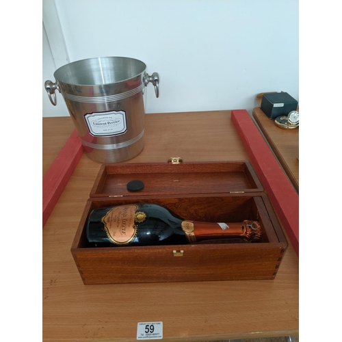 59 - A cased bottle of Grand Siecle Rose champange together with a Laurent Perrier ice bucket and bottle ... 